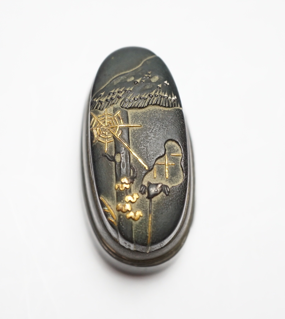 A Japanese mixed metal and bronze box made from 19th century sword fittings, decorated with a spider and web, 4cm